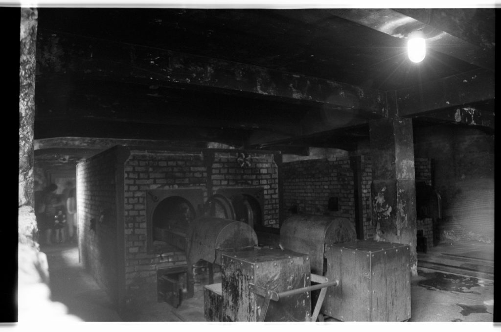 B/W photo of a blurry cremation area. Ovens and transporters in photograph.  Nikon D70 Film Camera 2004 - Negative Scan from Nikon COOLSCAN V ED 2008